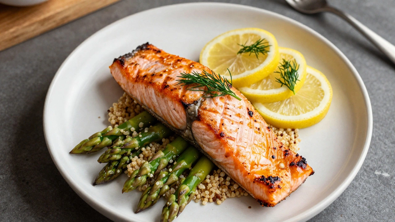 Grilled salmon fillet served with asparagus and lemon garnish